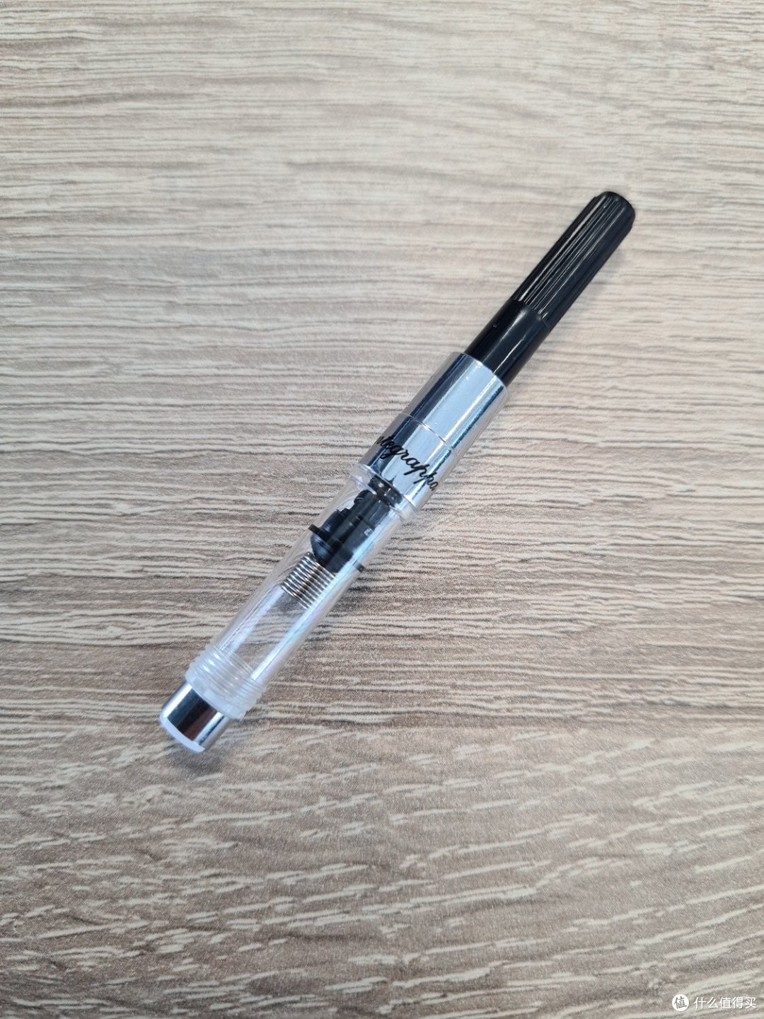 使用上墨器,里面加了弹簧来打破墨水的张力