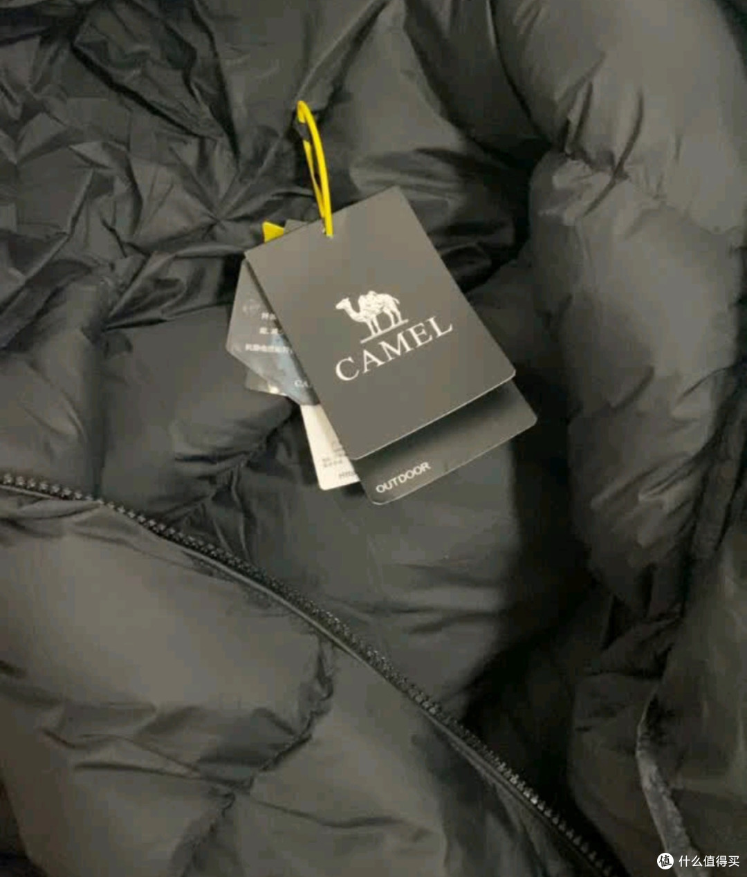 骆驼羽绒服质量扎实,异味需散