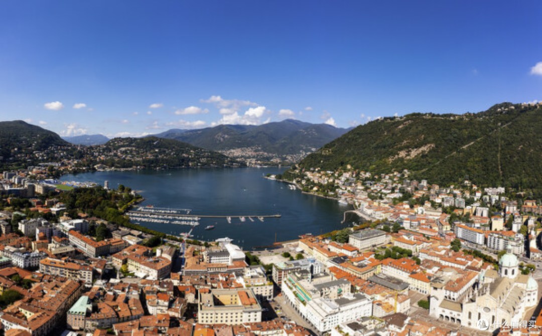 Aerial panorama of the Como old town by lake Como on a sunny summer day in Lombardy, Italy